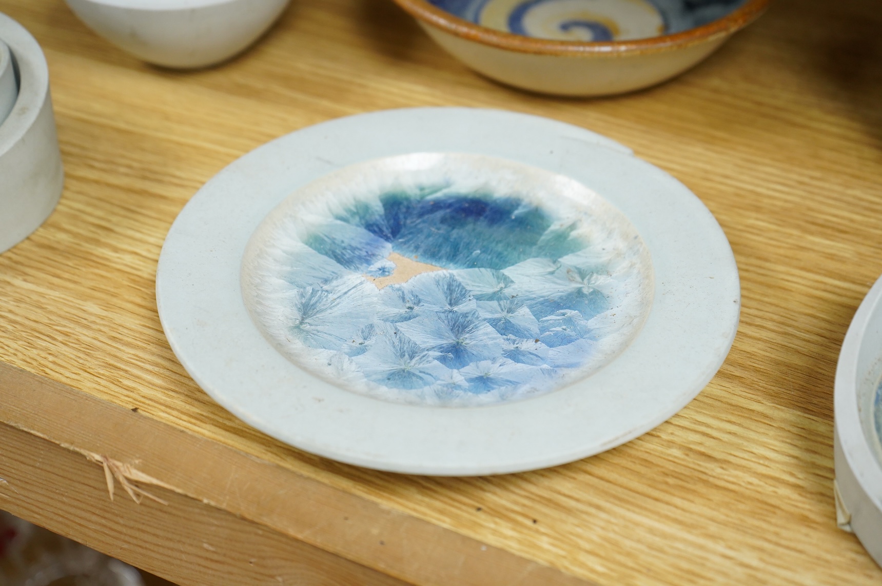A collection of studio pottery to include crystalline glazed works by Stephen R Jones Des, Brighton, vases and a pair of dishes, largest 22cm high